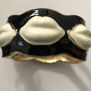 Black and white wrist cuff with lip design
